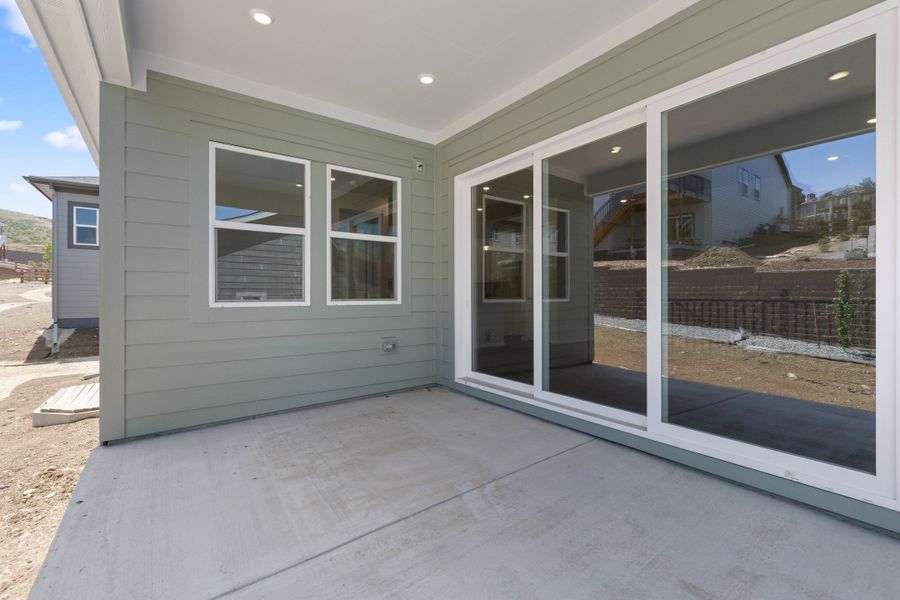 Exterior details and patio area of a home in The Manors Collection at Golden Overlook, Golden (Image 3).