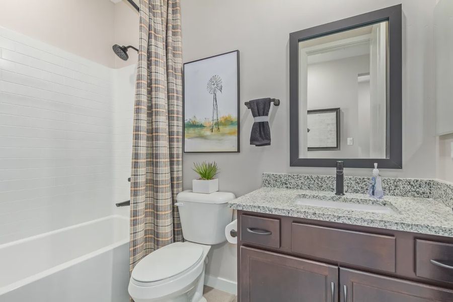 Representative furnished interior of a home built from the 1603 by Elliott Homes in Acacia at Santana, Yuma (Image 23).