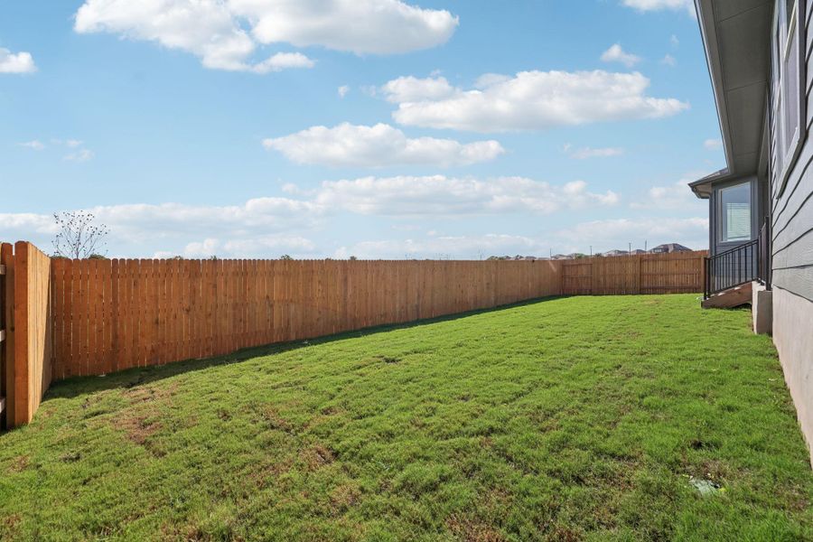 View of fenced backyard