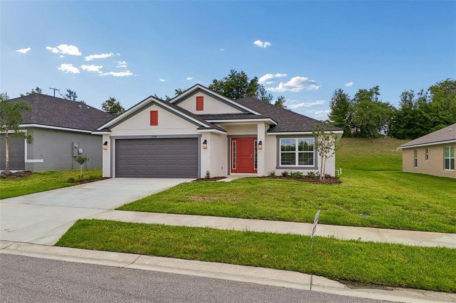 Front exterior of a new home in Abbey Glen, Dade City, FL, highlighting curb appeal (Image 29).