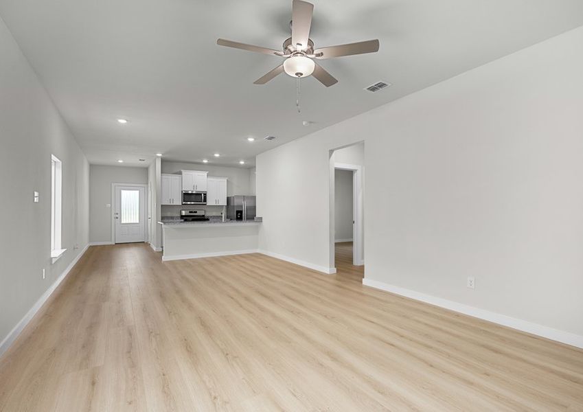 Open floor plan connects the living, dining and kitchen areas.