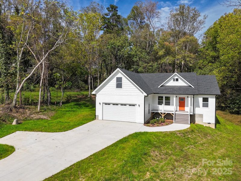 Front exterior of a new home in , Candler, NC, highlighting curb appeal (Image 1). Front exterior of a new home in , Candler, NC, highlighting curb appeal (Image 1).