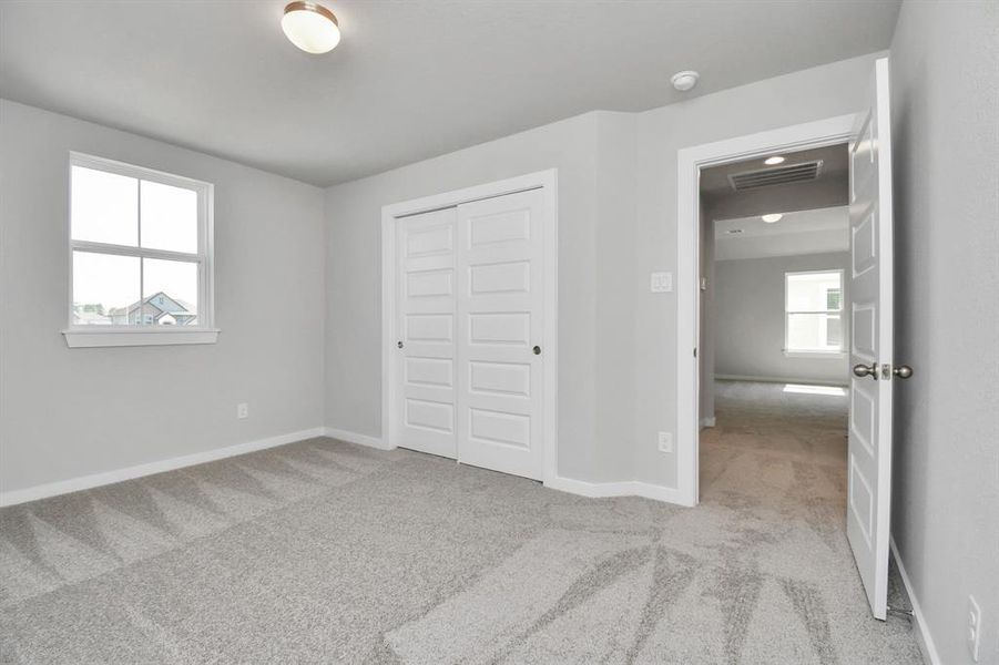 Step into this inviting bedroom retreat, boasting generously sized secondary bedrooms, plush carpeting underfoot, and ample natural light flooding through the large windows. With spacious closets to accommodate all your storage needs, this bedroom offers comfort and functionality in equal measure.