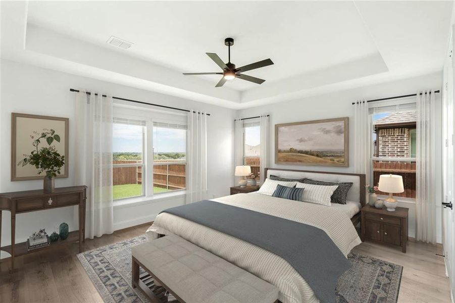 The Primary bedroom has a very nice view of the large backyard. An inviting room with such nice details that make it both comfortable and elegant.