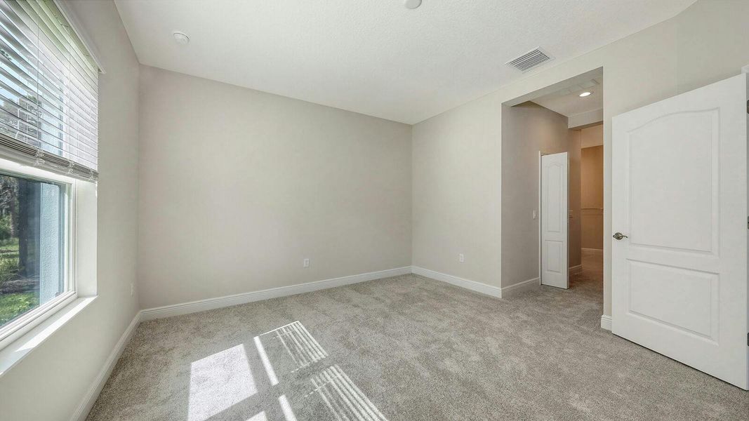 Spacious, unfurnished interior of a new home in Wildleaf Real Estate and Homes for Sale in Parrish, FL - Neal Communities, Parrish (Image 25). Spacious, unfurnished interior of a new home in Wildleaf Real Estate and Homes for Sale in Parrish, FL - Neal Communities, Parrish (Image 25).