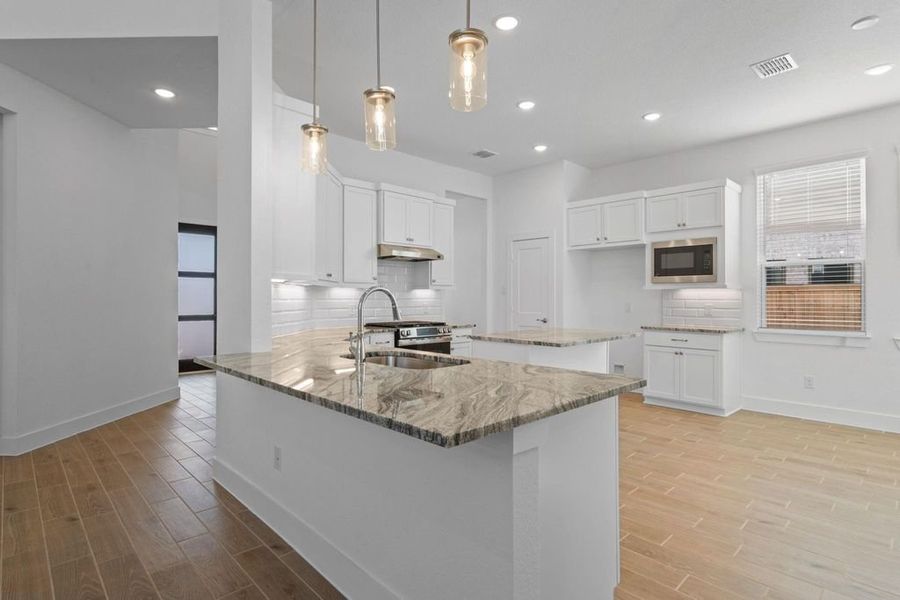 Furnished interior view inside a new home in Bridgeland, Cypress (Image 3).