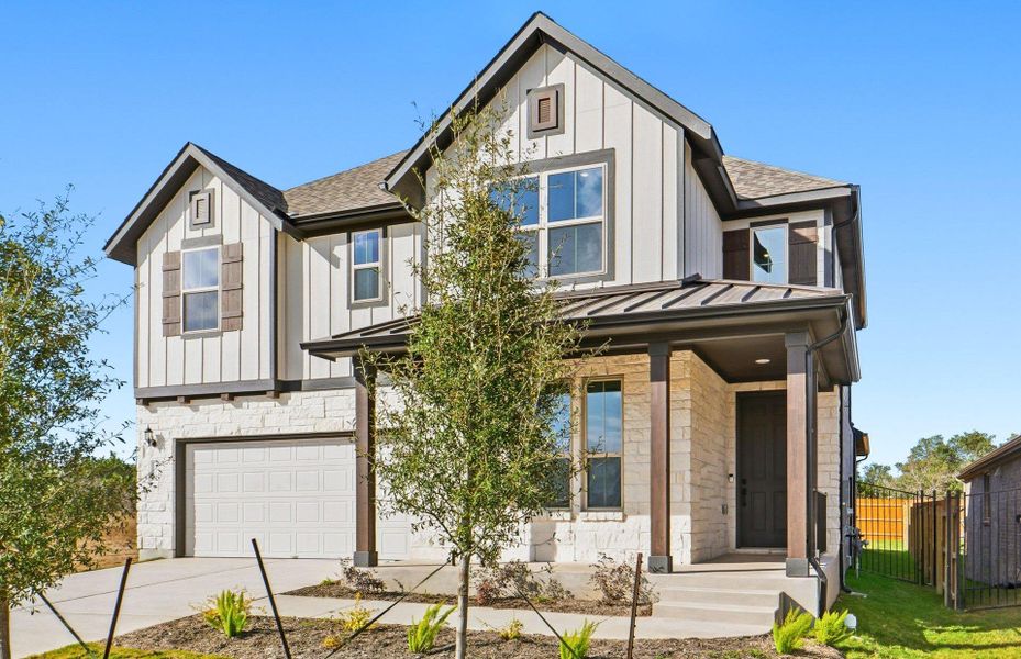 Front exterior of a new home in Saddleback at Santa Rita Ranch, Liberty Hill, TX, highlighting curb appeal (Image 20). Front exterior of a new home in Saddleback at Santa Rita Ranch, Liberty Hill, TX, highlighting curb appeal (Image 20).
