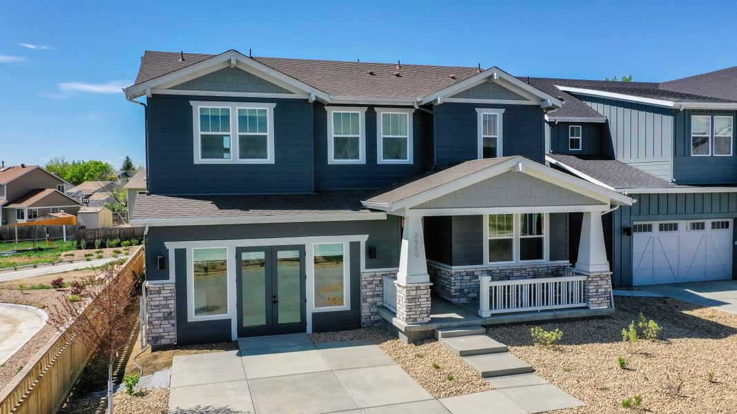 Front exterior of a new home in Arras Park, Thornton, CO, highlighting curb appeal (Image 18).