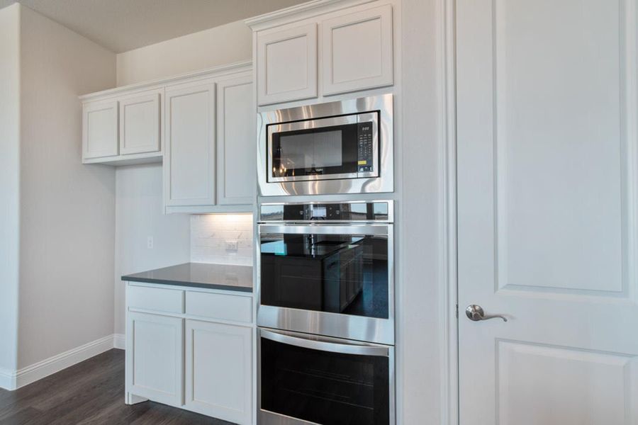 Kitchen | Concept 2406 at The Meadows in Gunter, TX by Landsea Homes