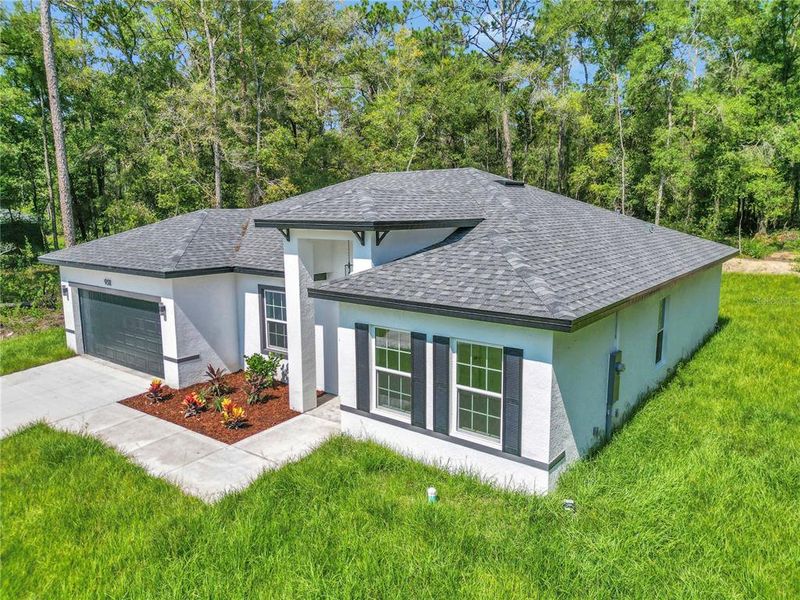 Front exterior of a new home in , Citrus Springs, FL, highlighting curb appeal (Image 27).