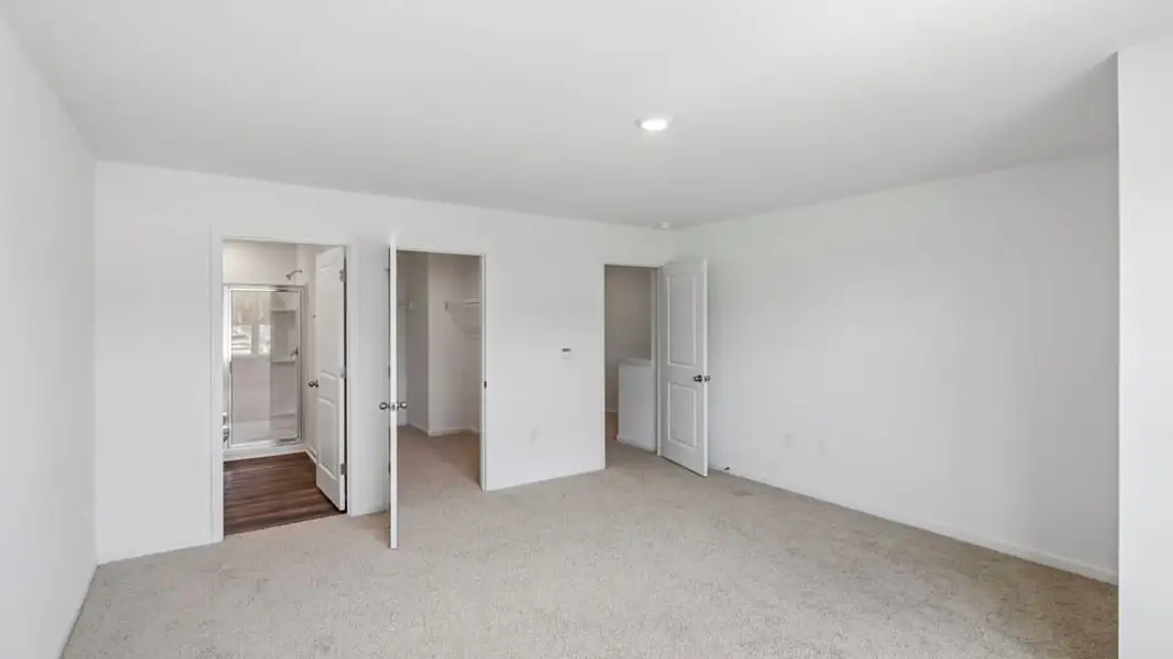Spacious, unfurnished interior of a new home in The Townes at Belle Grove, Wendell (Image 12).