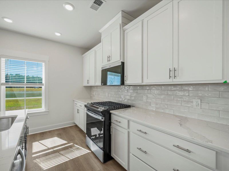 Furnished interior view inside a new home in The Coves at Lakes of Cane Bay II, Summerville (Image 6).