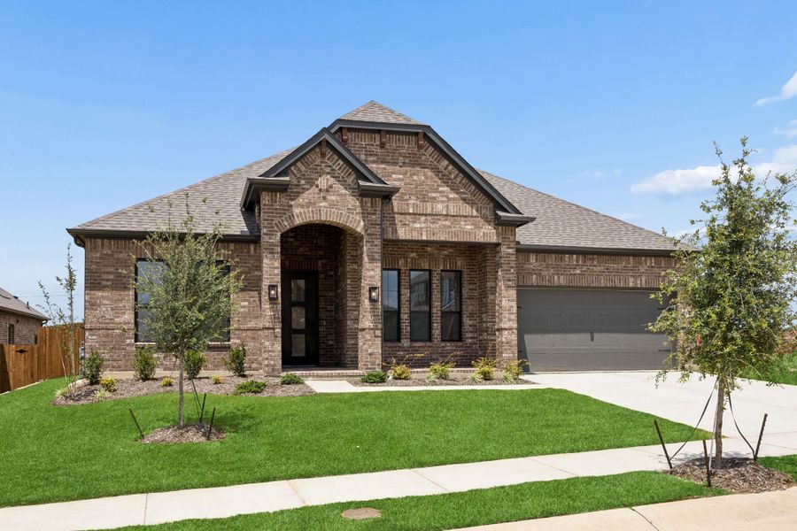 Front exterior of a new home in Country Lakes, Denton, TX, highlighting curb appeal (Image 2). Front exterior of a new home in Country Lakes, Denton, TX, highlighting curb appeal (Image 2).