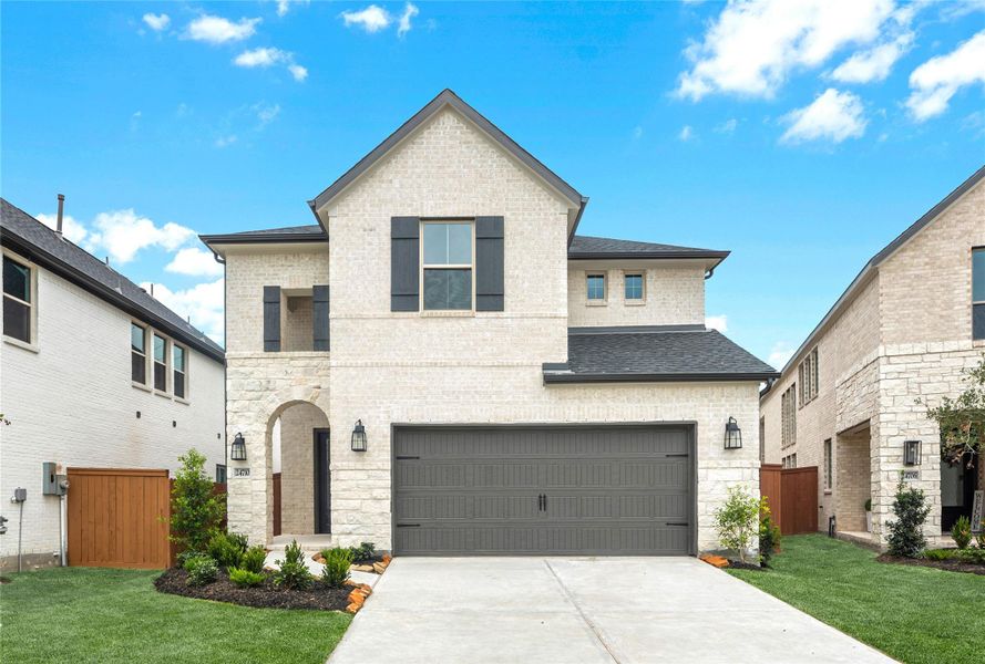Front exterior of a new home in Elyson - 40', Katy, TX, highlighting curb appeal (Image 2). Front exterior of a new home in Elyson - 40', Katy, TX, highlighting curb appeal (Image 2).