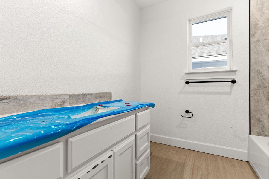 Bathroom with wood finished floors and vanity Bathroom with wood finished floors and vanity