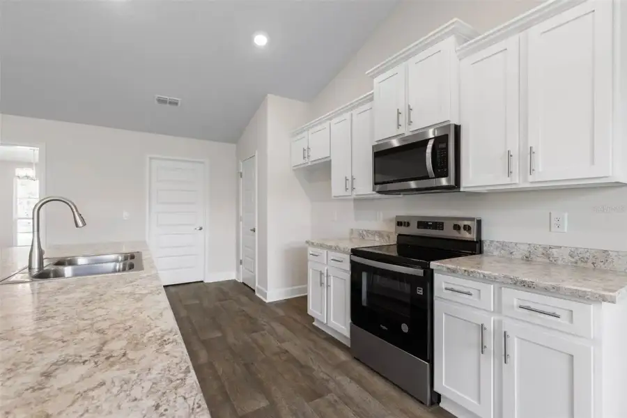 Representative furnished interior of a home built from the 2117 by Adams Homes in Flagler Estates, Hastings (Image 5).