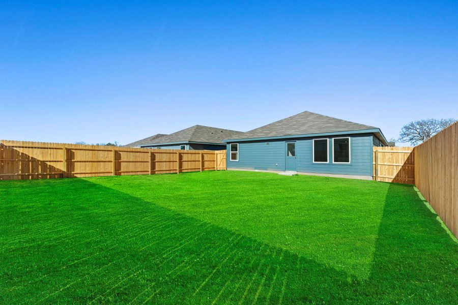 Exterior details and patio area of a home in Friendship Oaks, Fredericksburg (Image 2).