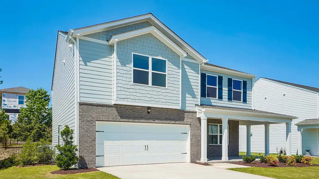 Front exterior of a new home in Anderson Farm, Wendell, NC, highlighting curb appeal (Image 2). Front exterior of a new home in Anderson Farm, Wendell, NC, highlighting curb appeal (Image 2).
