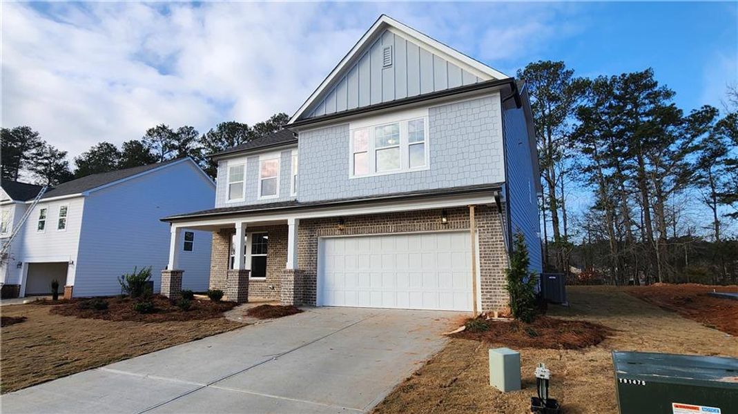 Front exterior of a new home in The Estates at Casteel, Bethlehem, GA, highlighting curb appeal (Image 15).