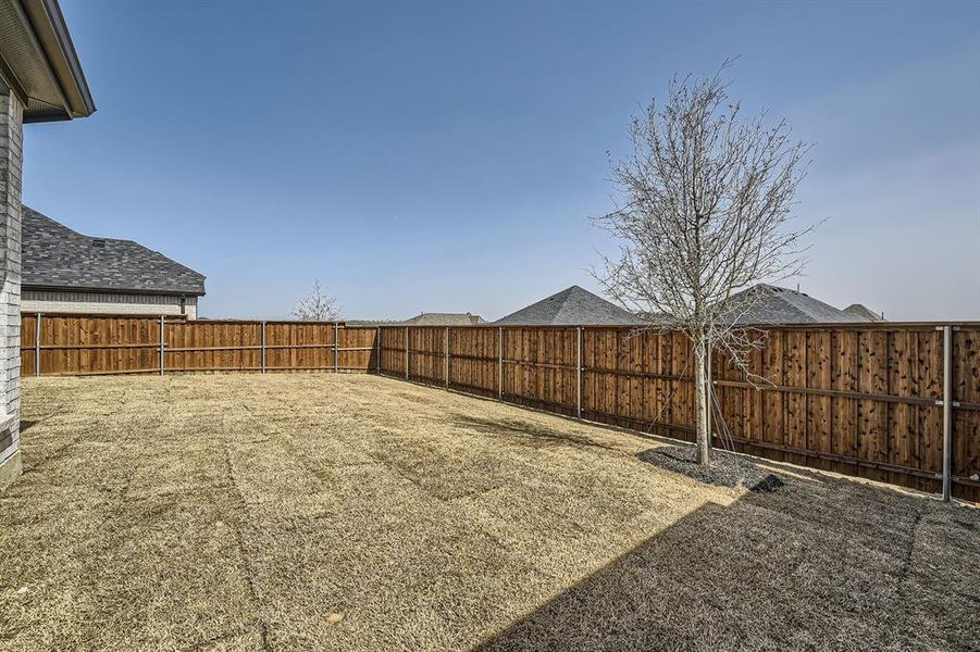 View of yard with a fenced backyard