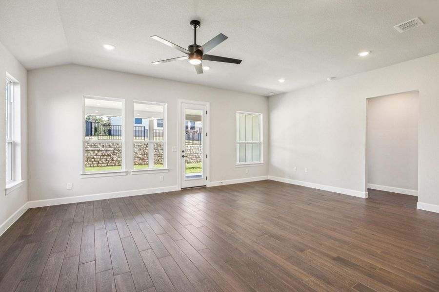 Empty room with recessed lighting, dark wood-style floors, and ceiling fan Empty room with recessed lighting, dark wood-style floors, and ceiling fan