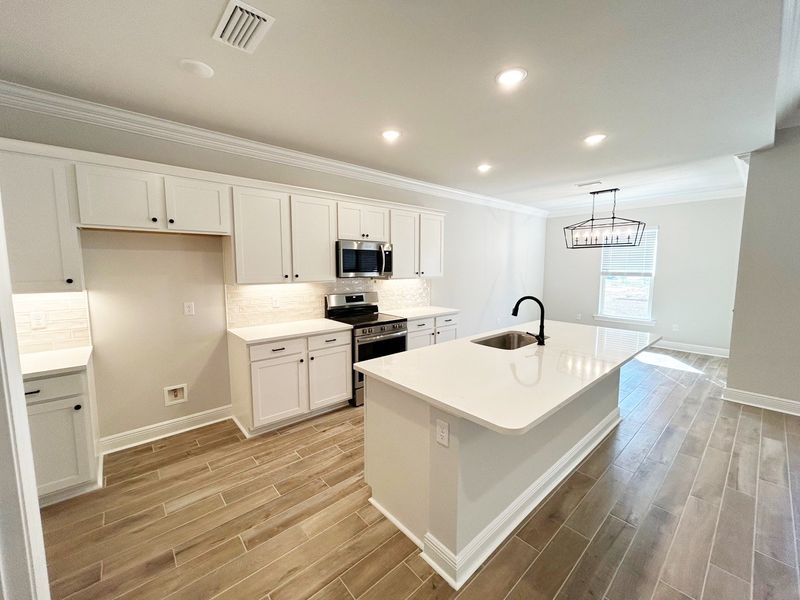 Furnished interior view inside a new home in Natureview, Freeport (Image 6).