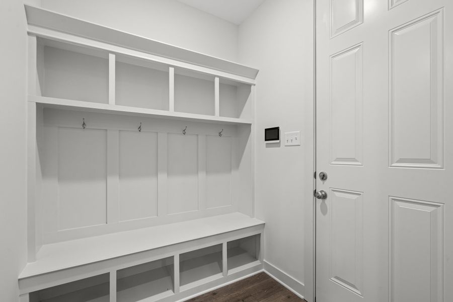 Mudroom with dark wood-style floors