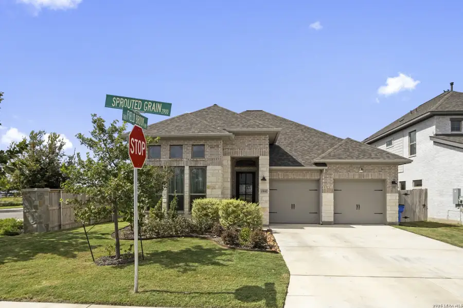 Front exterior of a new home in Meadows of Mill Creek, Seguin, TX, highlighting curb appeal (Image 21).