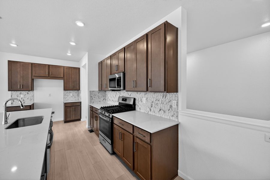 Furnished interior view inside a new home in Trailstone, Arvada (Image 9).