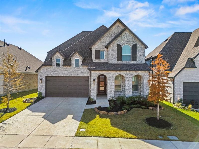 Front exterior of a new home in Thompson Farms: 50ft. lots, Van Alstyne, TX, highlighting curb appeal (Image 1). Front exterior of a new home in Thompson Farms: 50ft. lots, Van Alstyne, TX, highlighting curb appeal (Image 1).