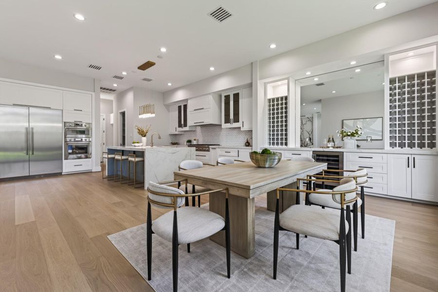 Sophisticated dining space with statement chandelier, perfect for entertaining guests.