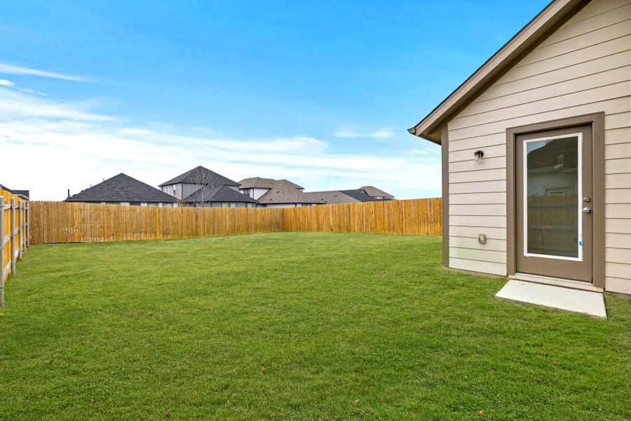 Exterior details and patio area of a home in Trinity Ranch, Elgin (Image 4).