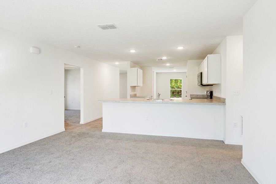 Representative furnished interior of a home built from the Foxtail by Holiday Builders in Port St Lucie, Port St. Lucie (Image 5).
