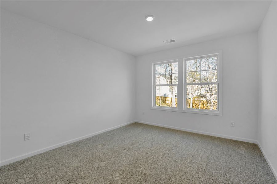 This airy room offers a tranquil retreat with ampl