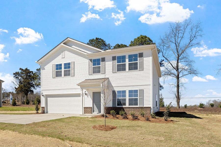 Front exterior of a new home in Cambridge Reserve, Angier, NC, highlighting curb appeal (Image 22).