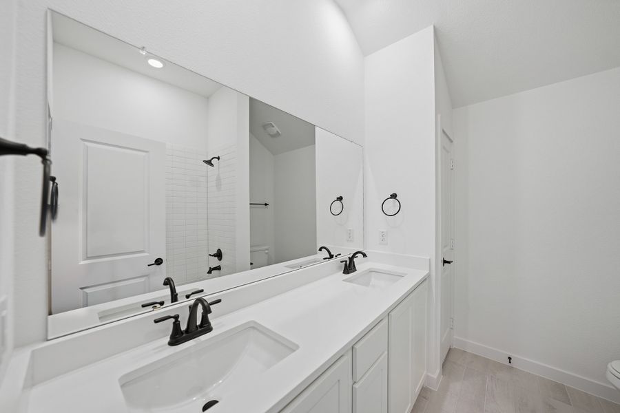 Furnished interior view inside a new home in Light Farms Brenham - 40' Lots, Celina (Image 9).