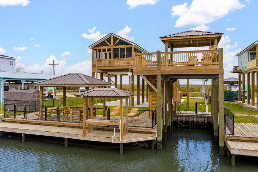 Canal Front home with a boat house with a boat lift