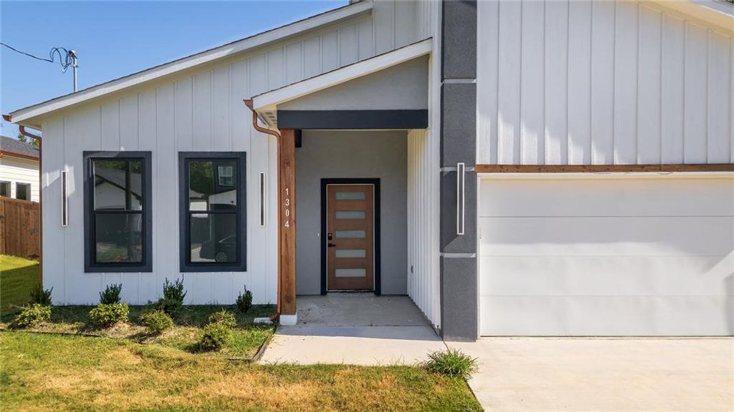 Front exterior of a new home in , Greenville, TX, highlighting curb appeal (Image 2). Front exterior of a new home in , Greenville, TX, highlighting curb appeal (Image 2).