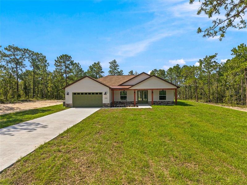 Front exterior of a new home in , Dunnellon, FL, highlighting curb appeal (Image 25).