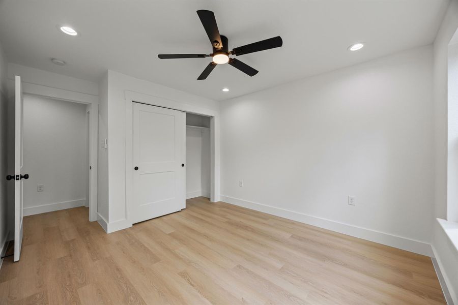 Unfurnished bedroom featuring light wood-style floors, recessed lighting, a closet, and ceiling fan Unfurnished bedroom featuring light wood-style floors, recessed lighting, a closet, and ceiling fan
