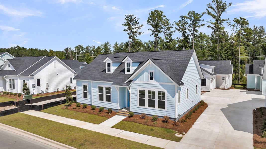 Front exterior of a new home in Nexton – Midtown – The Garden Collection, Summerville, SC, highlighting curb appeal (Image 20).
