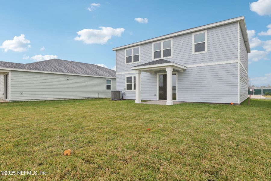 Front exterior of a new home in Lakes at Bella Lago - Signature Series, Green Cove Springs, FL, highlighting curb appeal (Image 17). Front exterior of a new home in Lakes at Bella Lago - Signature Series, Green Cove Springs, FL, highlighting curb appeal (Image 17).