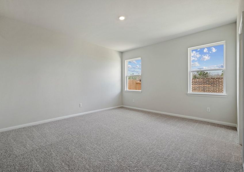 Master bedroom with two windows overlooking the back yard Master bedroom with two windows overlooking the back yard