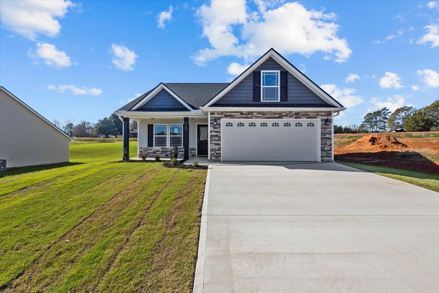Representative exterior photo of a completed home built from the Morgan by Enchanted Homes in Lonesome Dove, San Antonio, TX (Image 22).