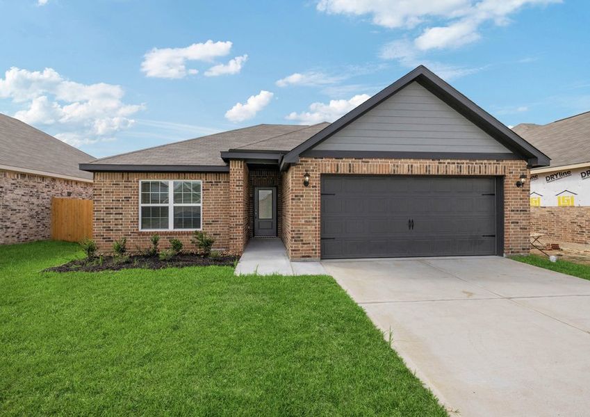 Exterior photo of the two-car garage Birkes plan with brick Exterior photo of the two-car garage Birkes plan with brick