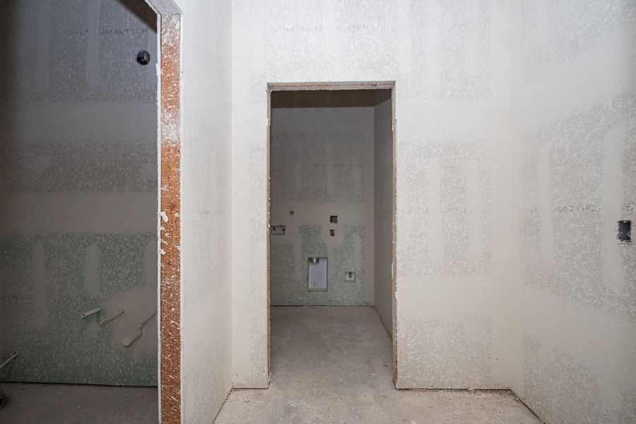 Spacious unfinished laundry room ready for your customization, featuring utility hookups and ample space for appliances. Spacious unfinished laundry room ready for your customization, featuring utility hookups and ample space for appliances.