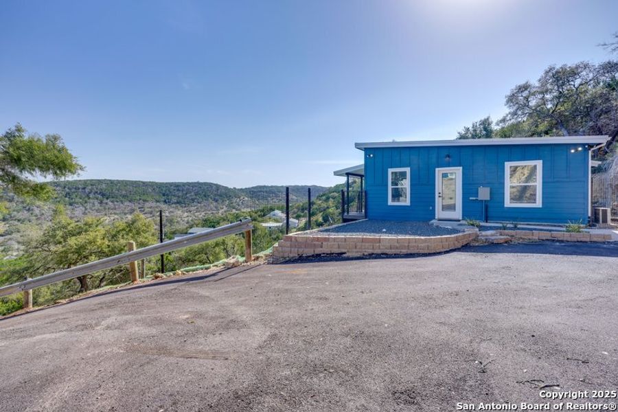Front exterior of a new home in , Canyon Lake, TX, highlighting curb appeal (Image 18).