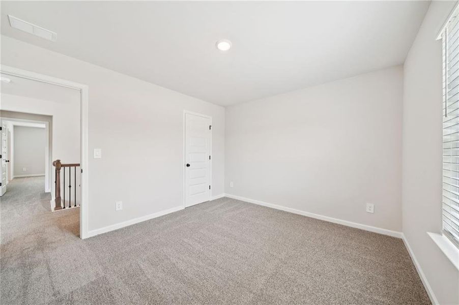 Spacious, unfurnished interior of a new home in Vines at Mill Creek - Estate Series, Braselton (Image 27).