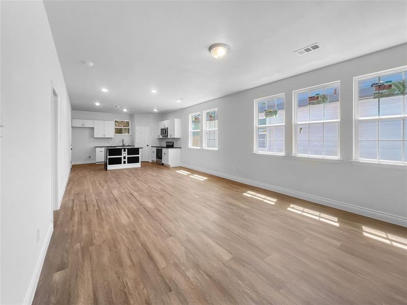 Unfurnished living room with light hardwood / wood-style flooring