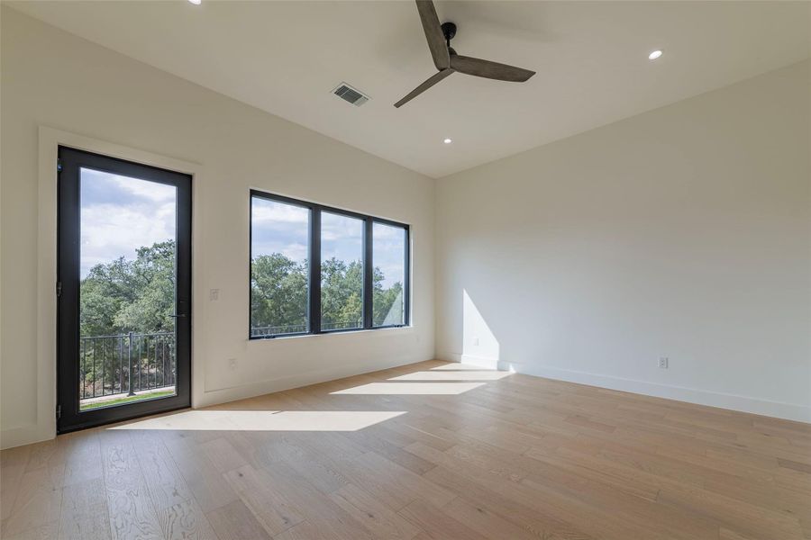 Unfurnished room with light wood-type flooring, recessed lighting, and a ceiling fan